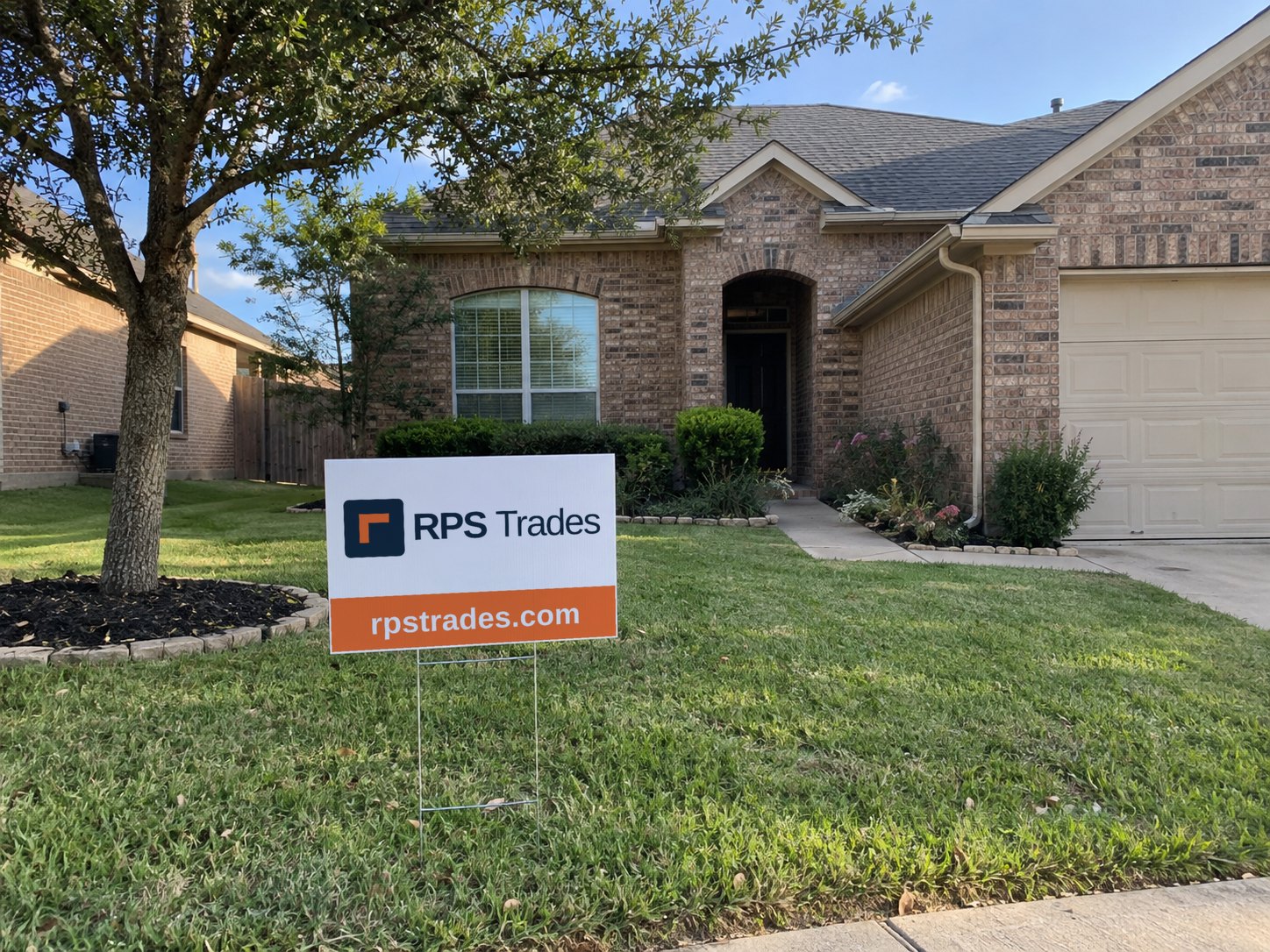 RPS Trades yard sign in front of a brick home